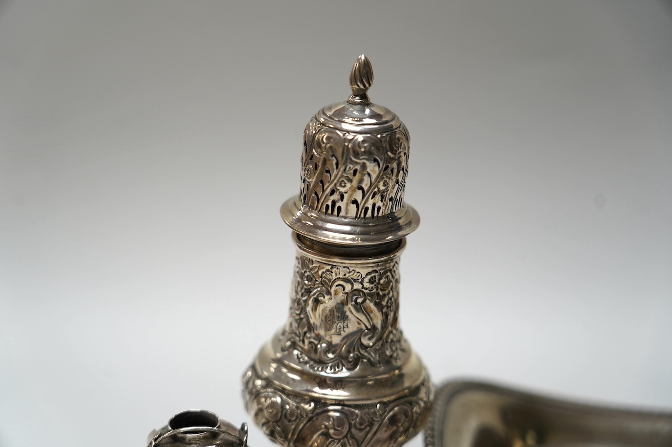 A George III silver snuffers stand, London, 1810, 22.8cm, together with sundry silver flatware, a silver sugar caster, a miniature Chinese white metal tea kettle by Wang Hing, lacking cover and one other item. Condition